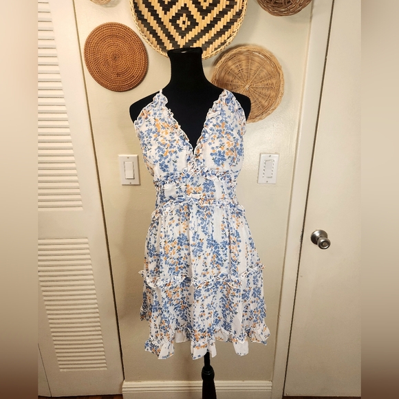 LAST ONE! Blue And White Floral Mini Dress With Ruffles And Criss-Cross Back - Picture 5 of 11